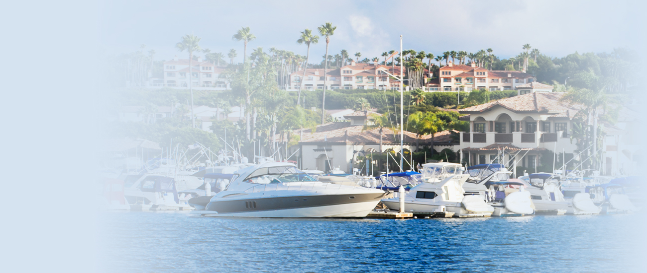 Marina with boats and waterfront buildings.